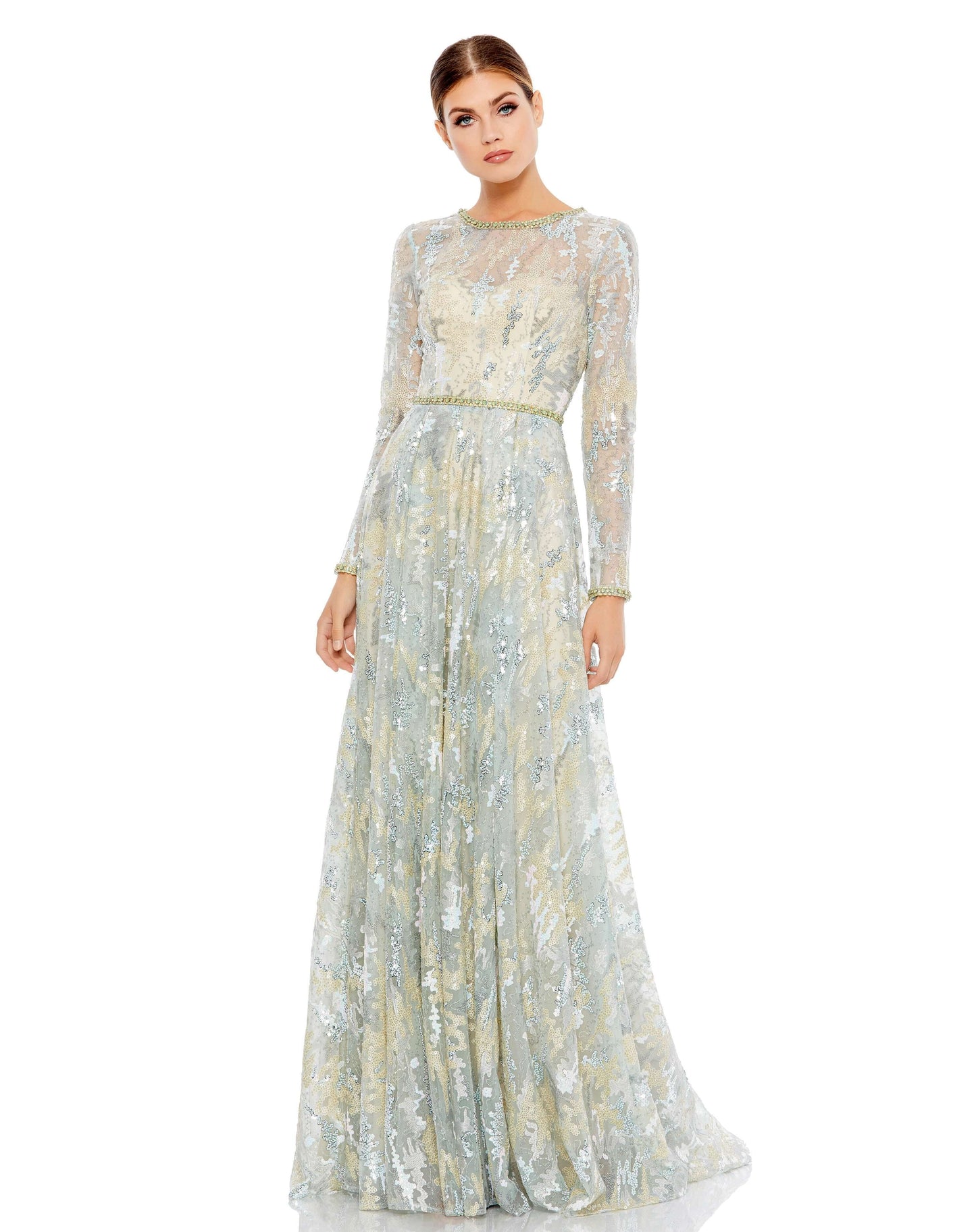 This stunning illusion long sleeve A-line gown. The illusion overlay is embroidered and embellished with sequins and hand-beaded floral accents. The gown is finished with a a rhinestone embellished belt, neckline, and cuffs. Mac Duggal Unlined illusion yo