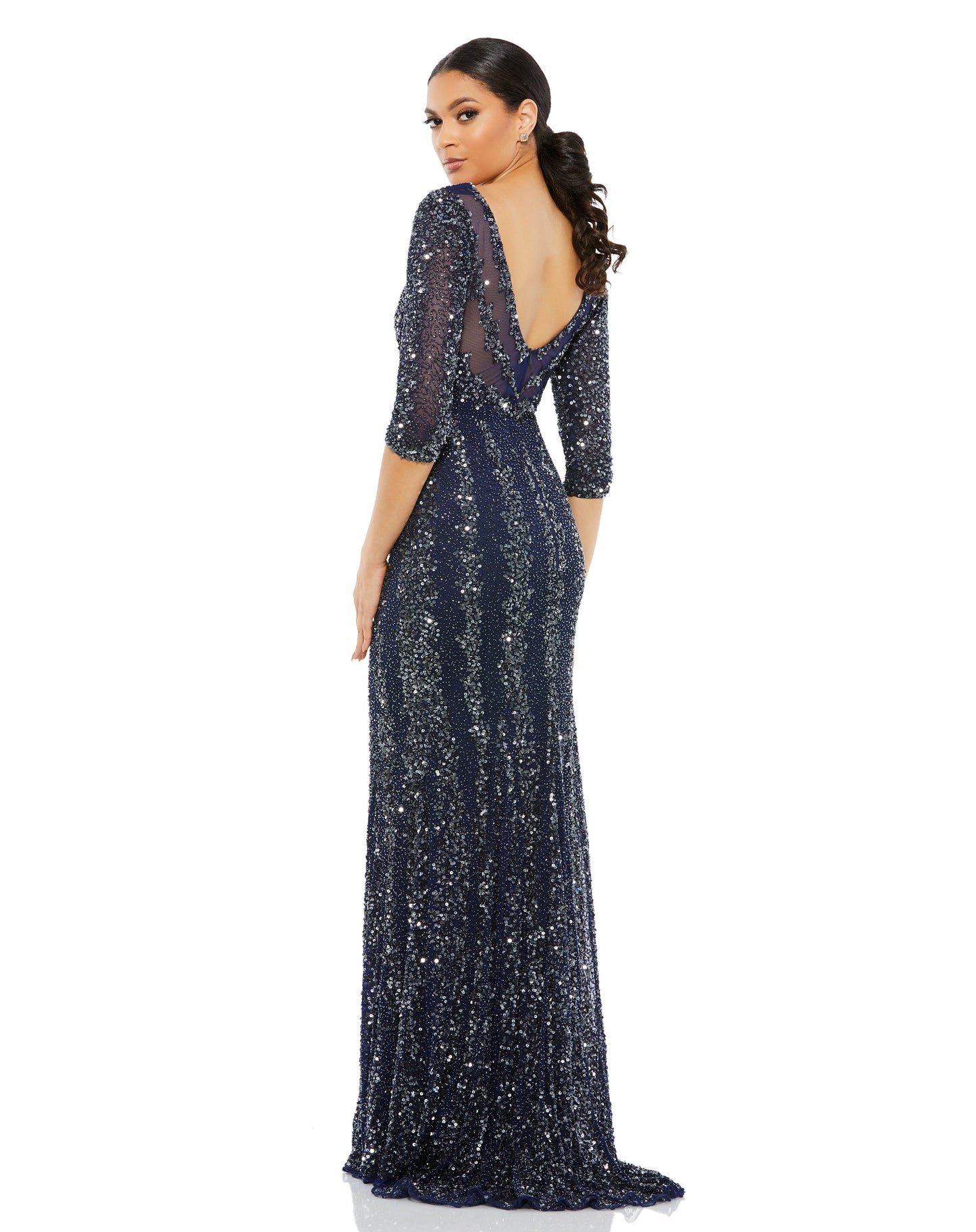Nothing can outshine you in a gown with hand-applied sequins and beads shimmering like the night sky. This slimming gown is designed with semi-sheer three-quarter-length sleeves, a décolletage-baring neckline, and a sensual V-cut back. Alternating cluster