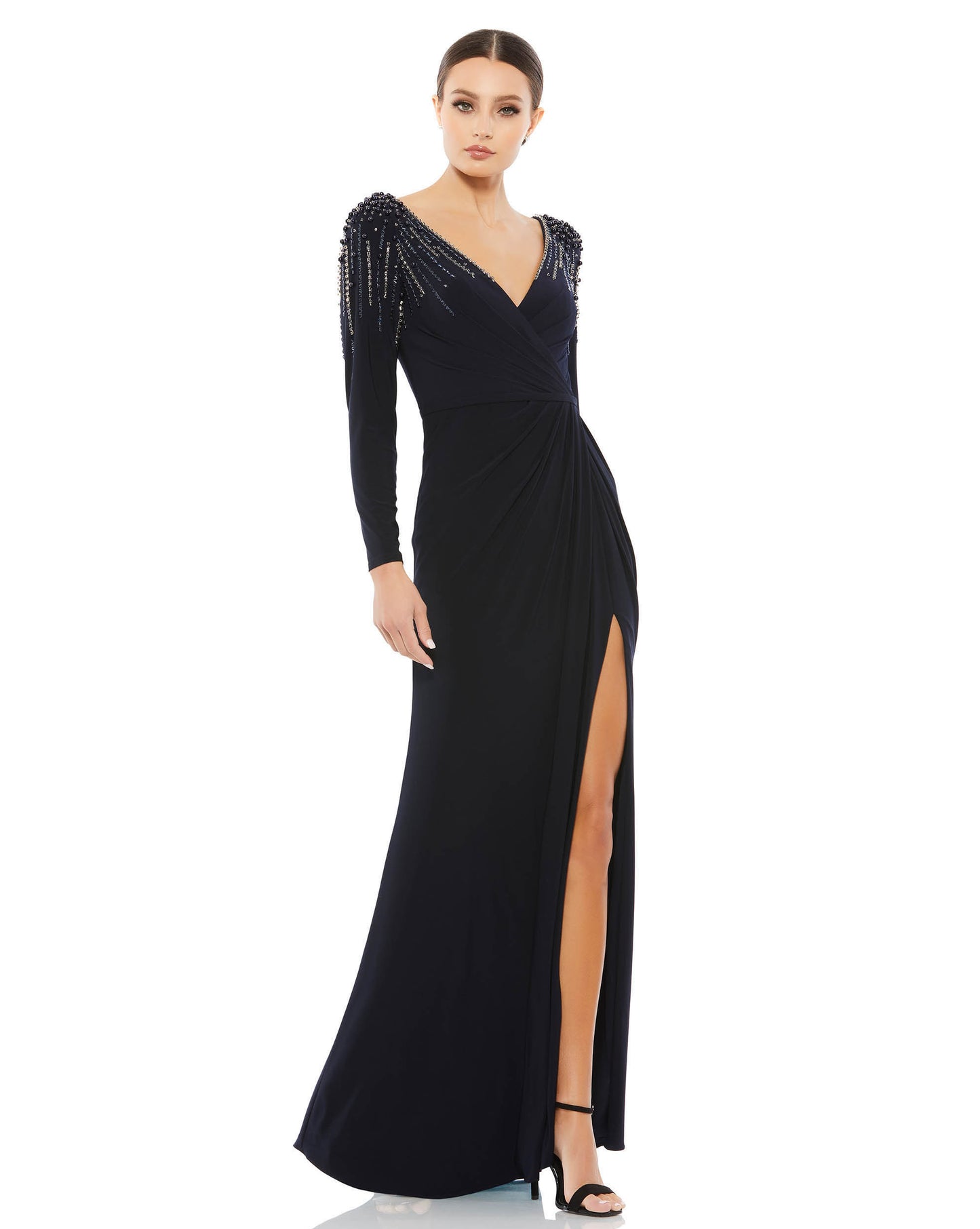 Mac Duggal Fully lined throughout body Stretch jersey fabric (100% polyester) V-neckline with ruched faux wrap bodice Full-length draped skirt with a thigh-high slit Tonal belt at the natural waistline Rows of pearls, sequins, beads, and rhinestones casca