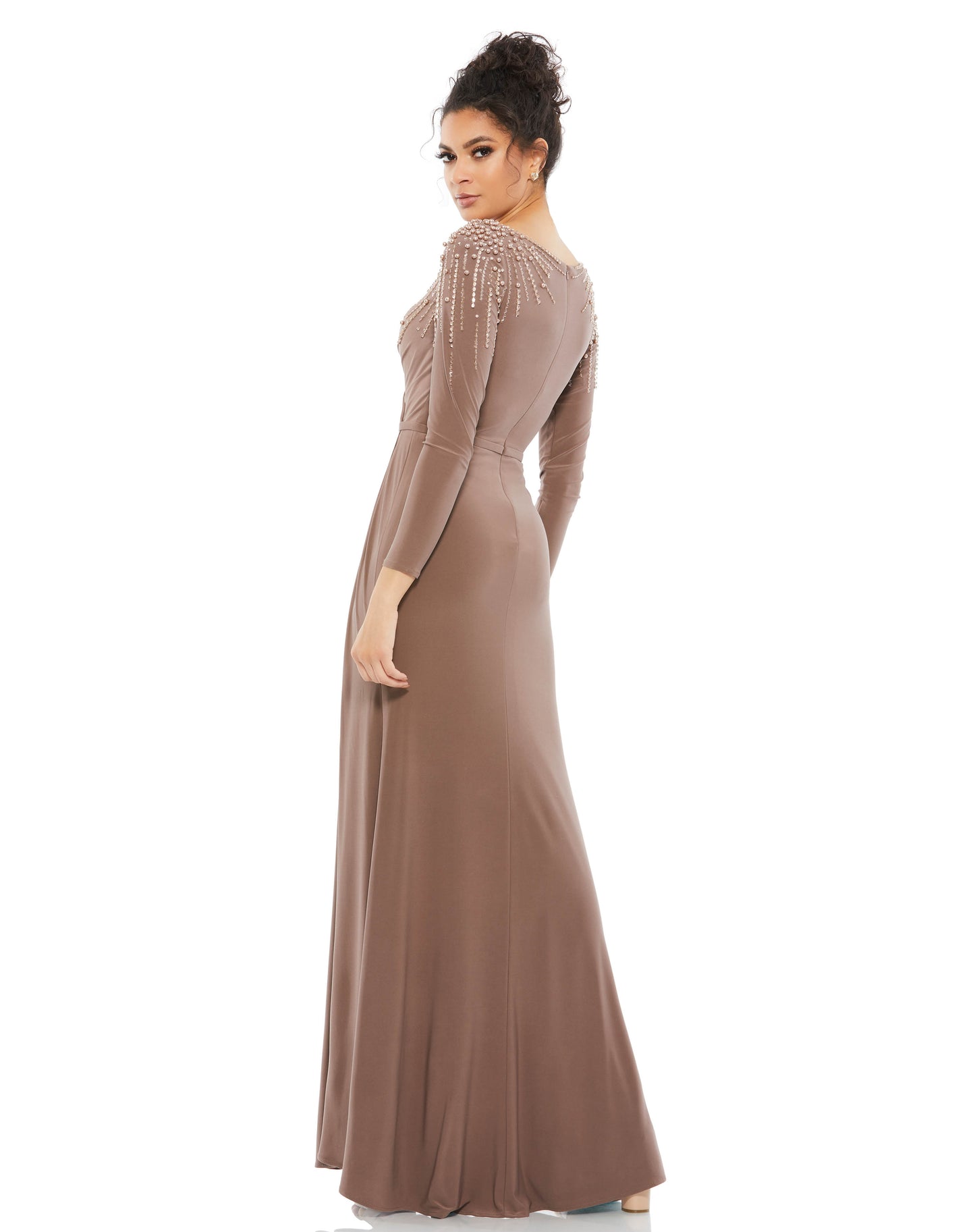 Mac Duggal Fully lined throughout body Stretch jersey fabric (100% polyester) V-neckline with ruched faux wrap bodice Full-length draped skirt with a thigh-high slit Tonal belt at the natural waistline Rows of pearls, sequins, beads, and rhinestones casca