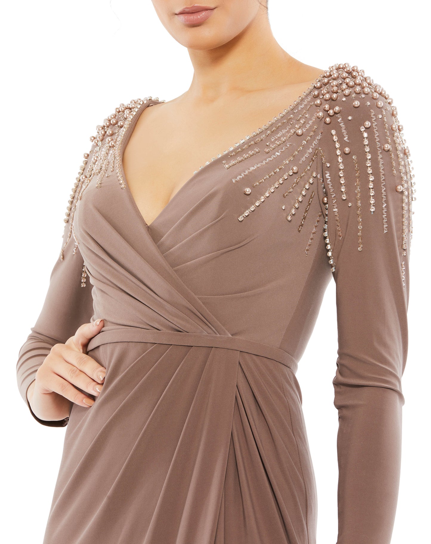 Mac Duggal Fully lined throughout body Stretch jersey fabric (100% polyester) V-neckline with ruched faux wrap bodice Full-length draped skirt with a thigh-high slit Tonal belt at the natural waistline Rows of pearls, sequins, beads, and rhinestones casca