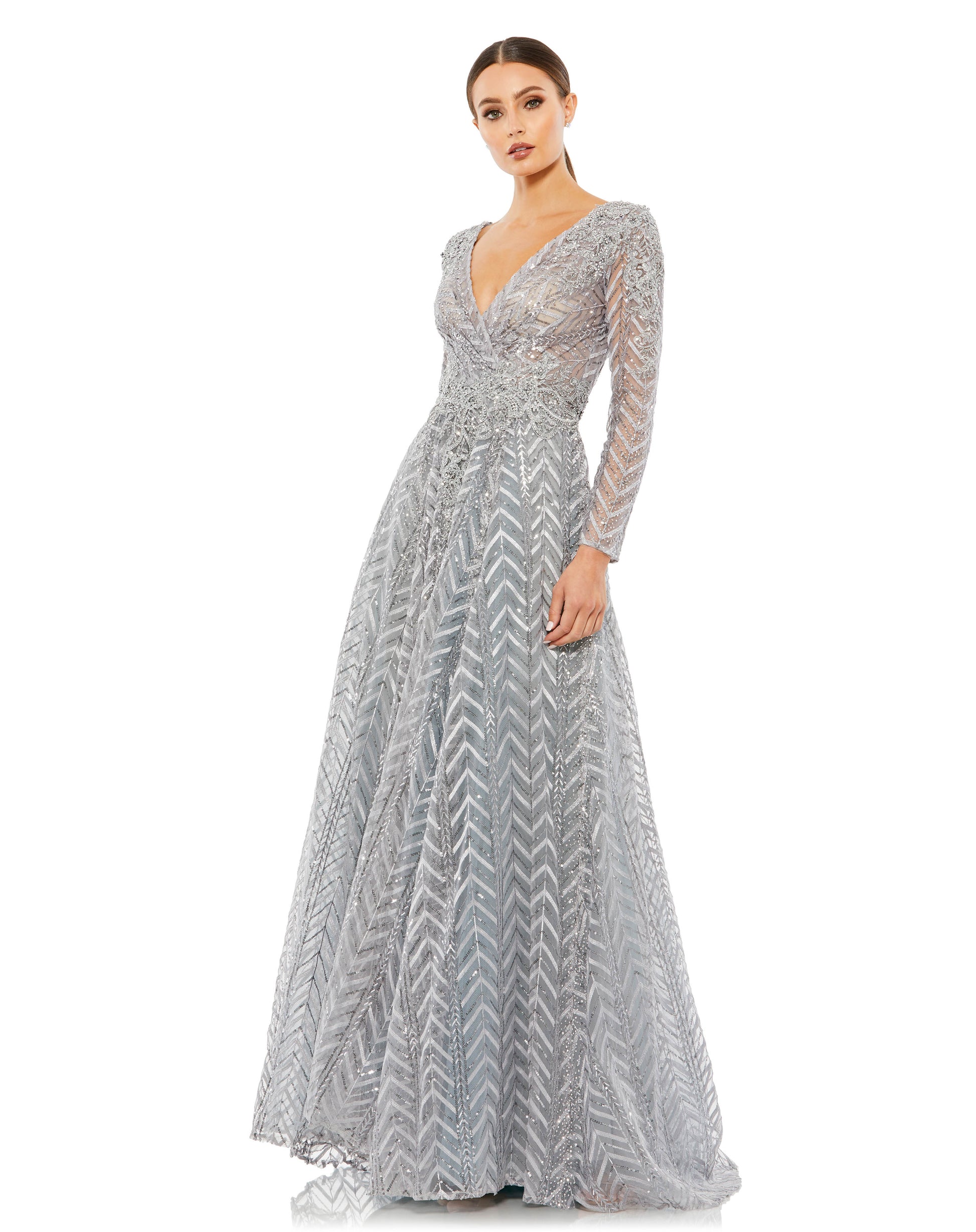 Embellished chevron-and-floral embroidered evening gown features semi-sheer illusion sleeves and bodice, a plunging v-neckline, and a floor length a-line skirt with a sweeping train. Mac Duggal Partially Lined Back Zipper 100% Polyester Long Sleeve Full L