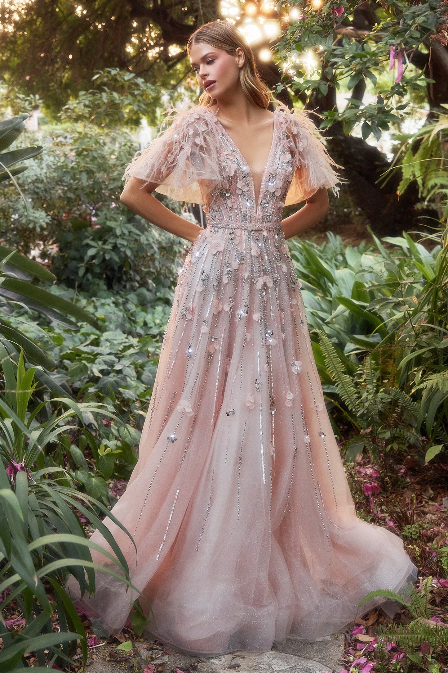 Step into your own dreamy fairytale with this breathtaking petal gown. This magnificent gown features the classic A-line shape of the tulle that's layered to perfection, beautifully adorned in elegant beading and petals to create a delicate, feminine outl