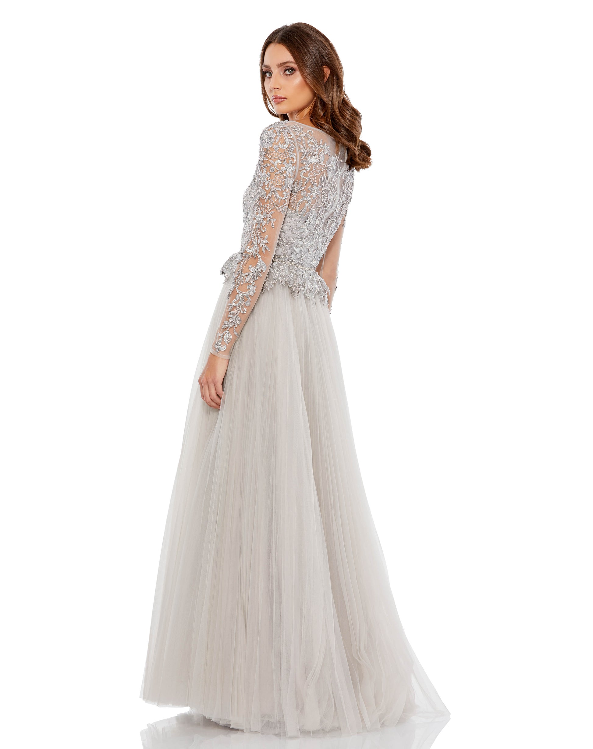 Regal long-sleeved lace ballgown with floral applique accents, peplum waist, semi-sheer back, and a full-length flowing skirt. Mac Duggal Partially lined Back Zipper 100% Polyester Long Sleeve Floor Length Style #11168