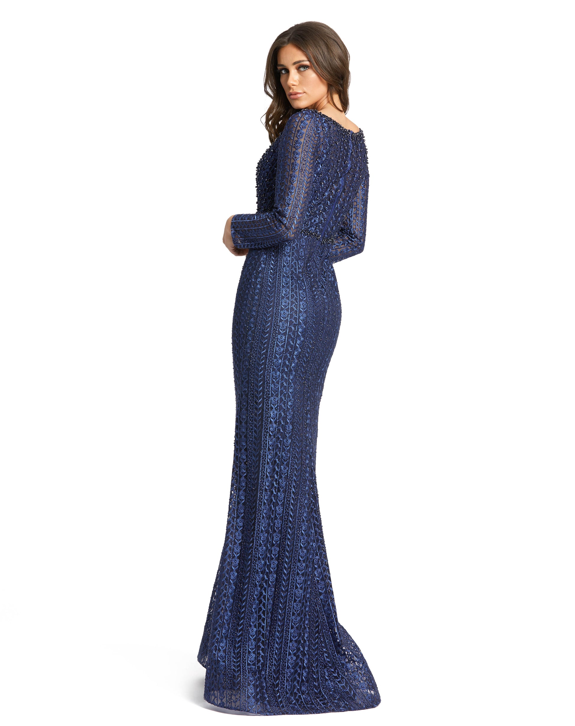 Mac Duggal Sheer embellished embroidered overlay; 100% polyester lining Fully lined through bodice and skirt; sheer unlined long sleeves V-neckline Long sleeves Beaded waist detail Sweeping train Concealed back zipper Approx. 62.5" from top of shoulder to