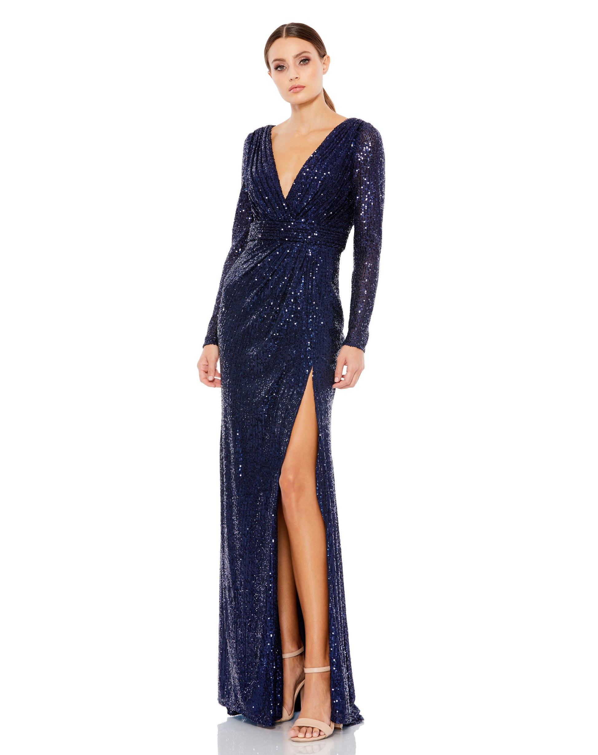Long sleeved fully sequined evening gown accented with a ruched waist and thigh-high front slit. Ieena for Mac Duggal Fully Lined Back Zipper 100% Polyester Long Sleeve Approx. length from shoulder to hem: 62.5" V-Neck Style #26490