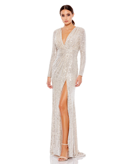 Long sleeved fully sequined evening gown accented with a ruched waist and thigh-high front slit. Ieena for Mac Duggal Fully Lined Back Zipper 100% Polyester Long Sleeve Approx. length from shoulder to hem: 62.5" V-Neck Style #26490