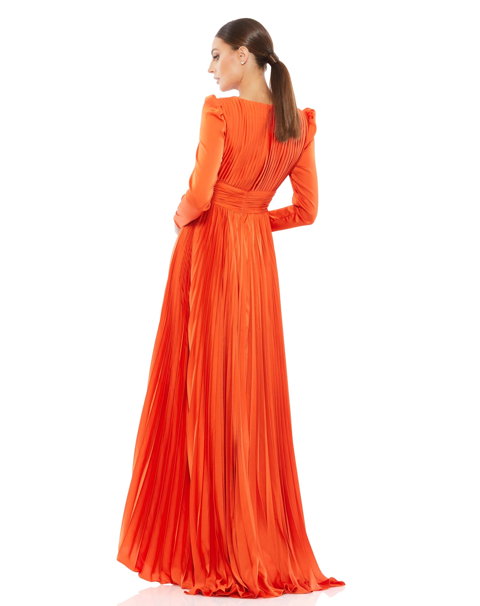 Chic faux-wrap satin gown with puffed shoulders, a v-neckline with a pleated bodice and a full-length pleated skirt. Ieena for Mac Duggal Fully Lined Back Zipper 100% Polyester Floor Length Long Sleeve Style #26542