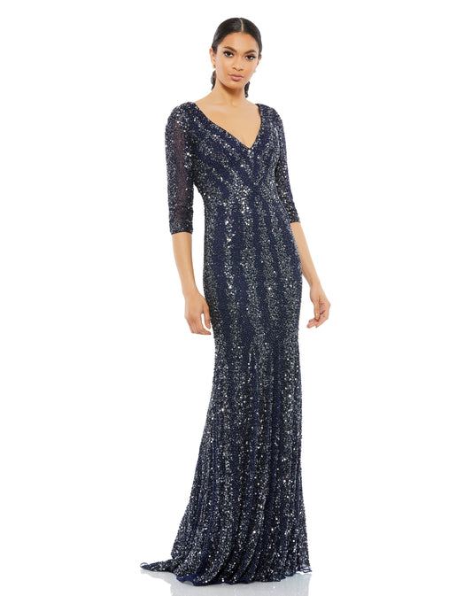 Nothing can outshine you in a gown with hand-applied sequins and beads shimmering like the night sky. This slimming gown is designed with semi-sheer three-quarter-length sleeves, a décolletage-baring neckline, and a sensual V-cut back. Alternating cluster
