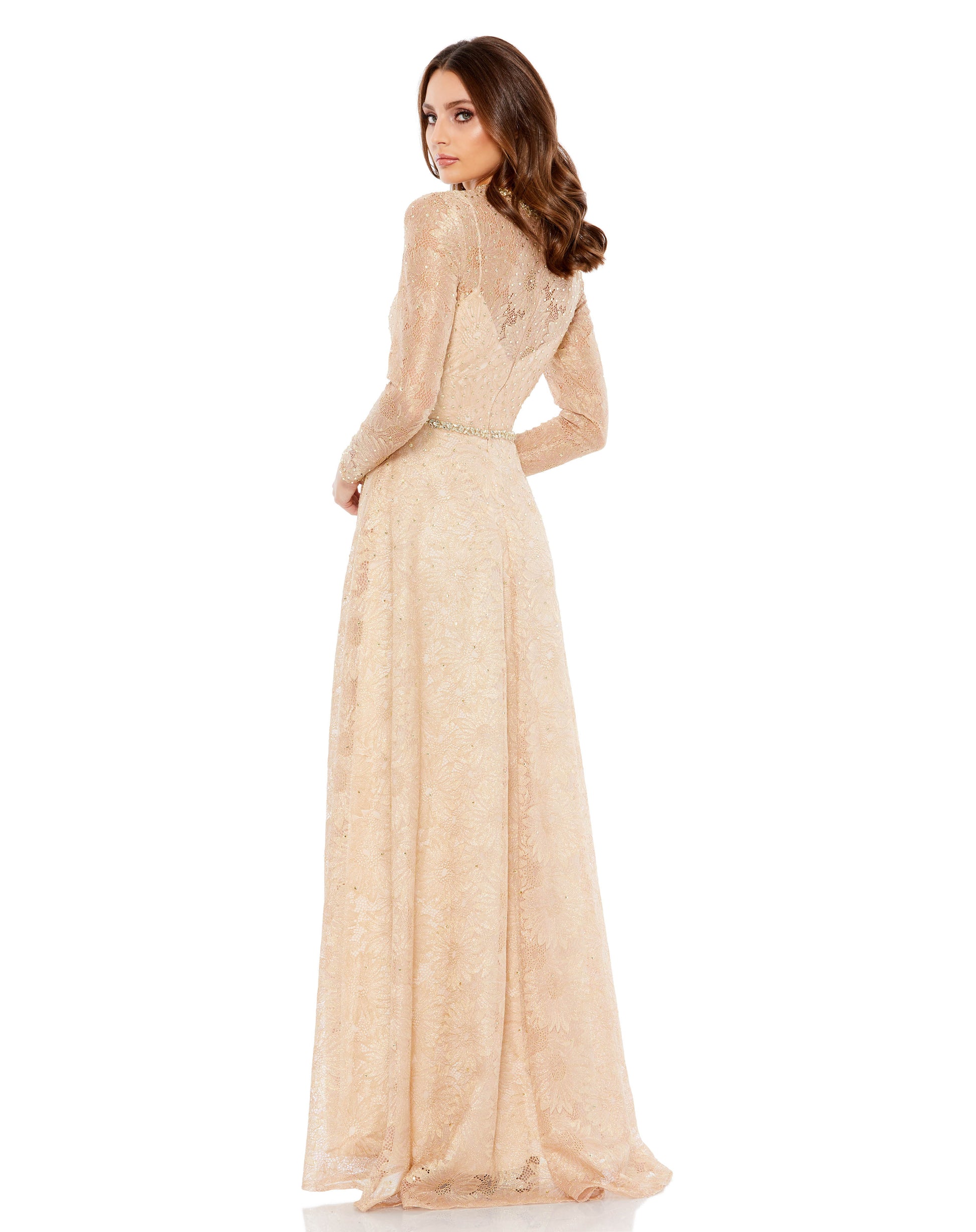 Elegant long-sleeved lace evening gown with an illusion neckline and sleeves, bejeweled neckline, and a flowing a-line skirt. The natural waist is accented by a stunning jeweled belt. Sleeves feature hidden zippers for easy dressing. Mac Duggal Partially