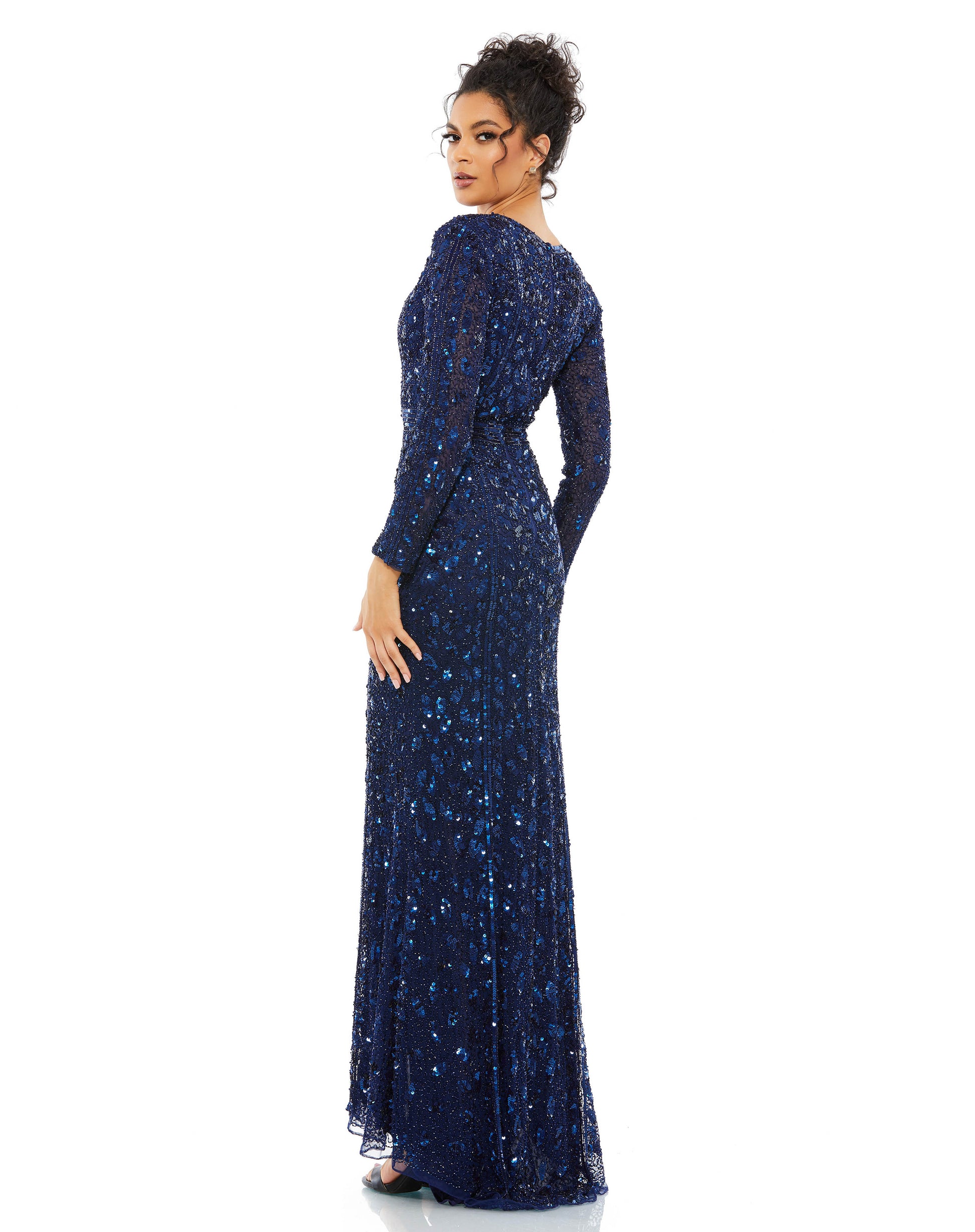 Fully embellished evening gown cut with a dramatic plunge neckline, thigh-high front slit, and sequin accents at the natural waist Mac Duggal Back Zipper 100% Polyester Long Sleeve Full Length Thigh-high slit V-Neck Style #5002