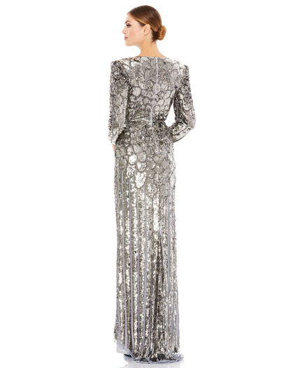 Stunning fully-sequined evening gown with a v-neckline, long sleeves with a slightly-puffed shoulder, and a high front slit. Mac Duggal Fully Lined Back Zipper 100% Polyester Long Sleeve Full Length V-Neckline Style #5382