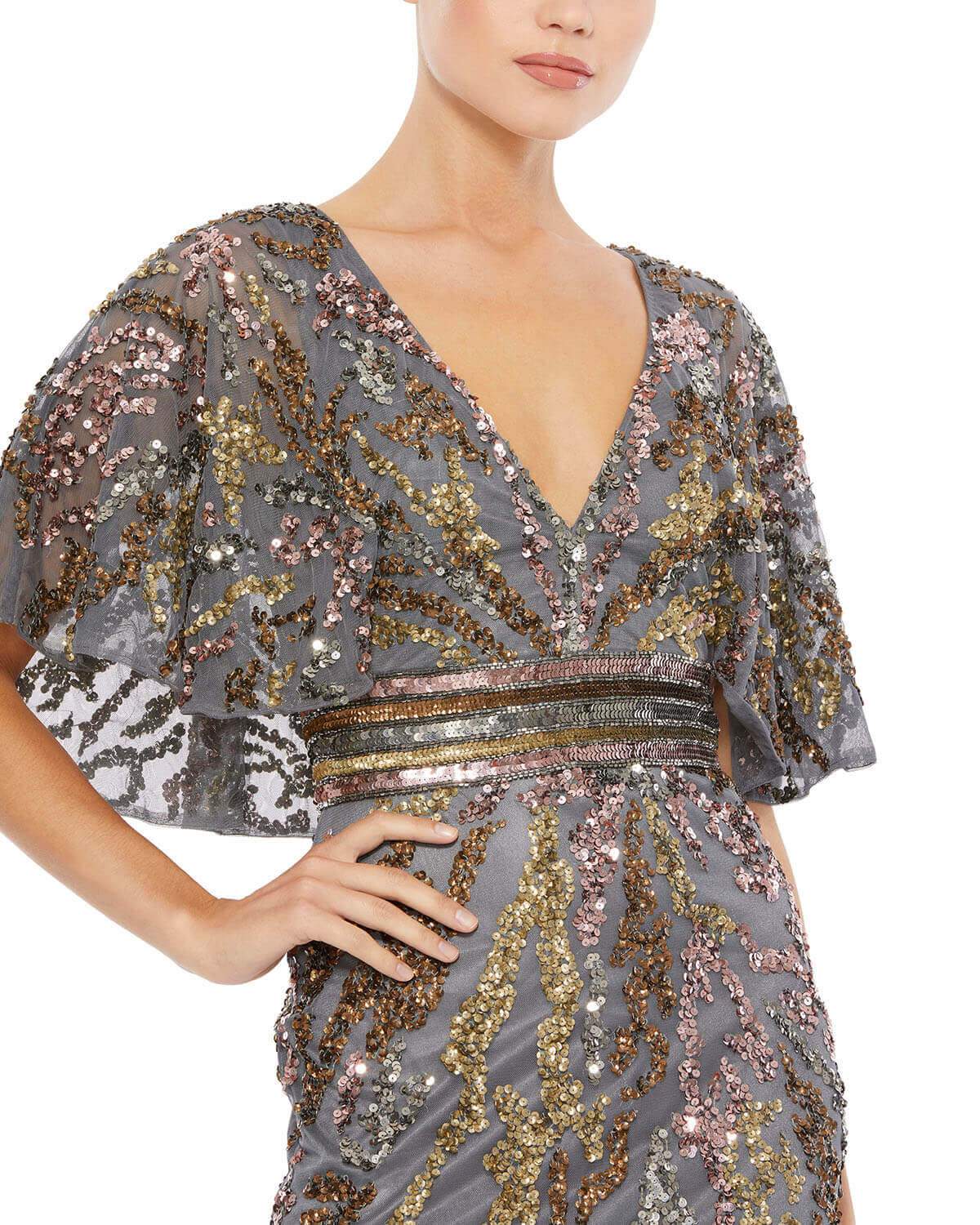 This striking evening gown features a low v-neckline, sequin-belted empire waist, short bell sleeves, and a cape-style back. The gown's mesh overlay is ornately embellished with abstractly-patterned sequins. Mac Duggal Fully Lined 100% Polyester V-Neck Sh