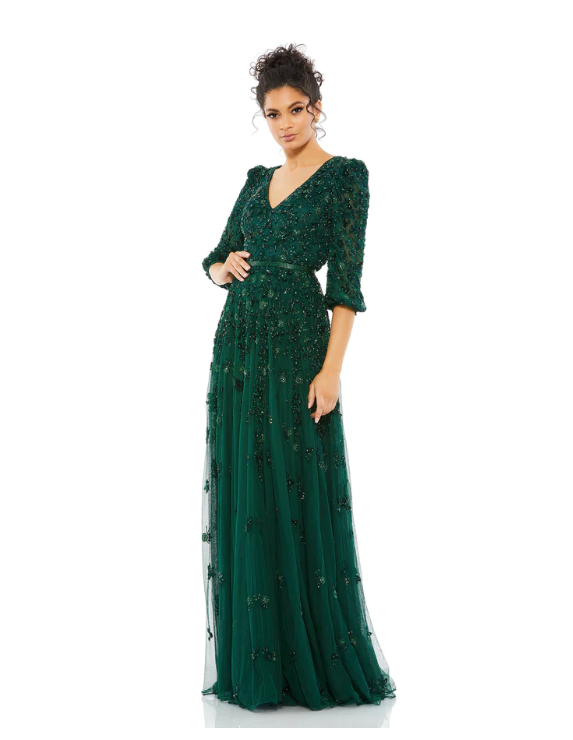 Mac Duggal Embellished tulle fabric (100% polyester) Fully lined through bodice and skirt; semi-sheer unlined sleeves V-neckline 3/4 sleeves Allover floral beaded embellishments Concealed back zipper Approx. 62.5" from top of shoulder to bottom hem Availa