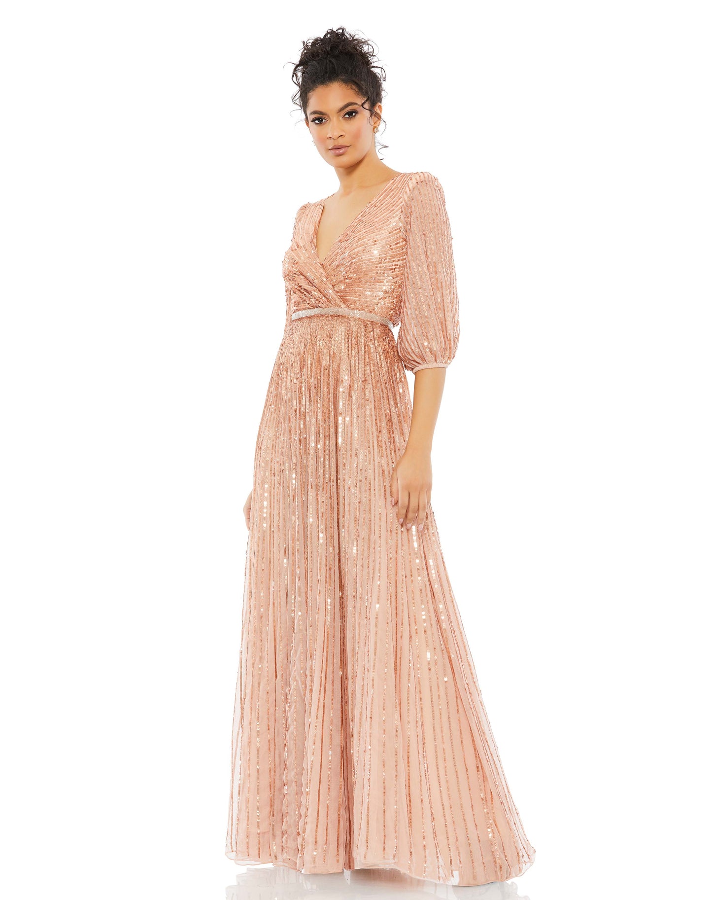 Indulge your present-day princess fantasies with this dreamy dress. Our gown is made of whisper-thin tulle with sequin stripes that appear farther apart as the skirt gets fuller. And it’s not just the embellishments that elevate this confection. The dress