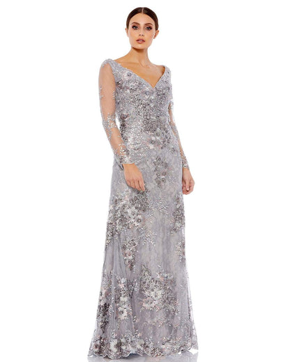 Elegant floor-length evening gown featuring illusion sleeves and plunging v-neckline. Gown adorned with floral embroidery and dainty beaded embellishments. Mac Duggal Back Zipper 100% Polyester Long Sleeve Full Length V-Neck Style #67539