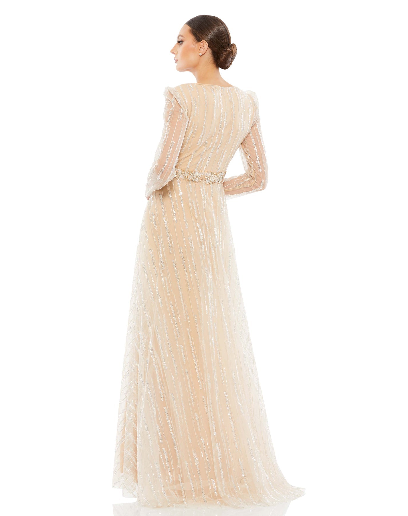 Champagne floor length gown with sheer long sleeves, gorgeous silver sequin, and beaded waist. Mac Duggal Fully lined through body and skirt; Sheer unlined sleeves Sewn-in bust cups 100% Polyester Back Zipper V-neck Long Sleeve Full Length Style #67859