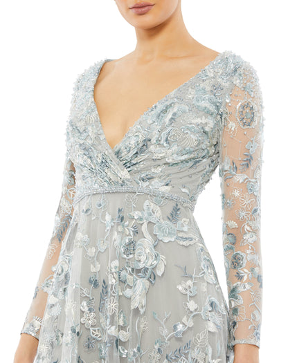 Mac Duggal Hand-embellished embroidered overlay; 100% polyester lining Fully lined through bodice and skirt; sheer unlined sleeves V-neckline Long sleeves Beaded waist detail Floral embroidery accented by hand-stitched sequins A-line silhouette Concealed