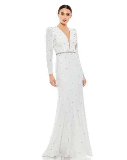 Ieena for Mac Duggal Jersey fabric (100% polyester) Fully lined through body Plunging v-neckline Long sleeves Mesh bust inset Puff shoulders All-over jewel encrusted embellishments Rhinestone detailed waist Concealed back zipper Approx. 62.5" from top of
