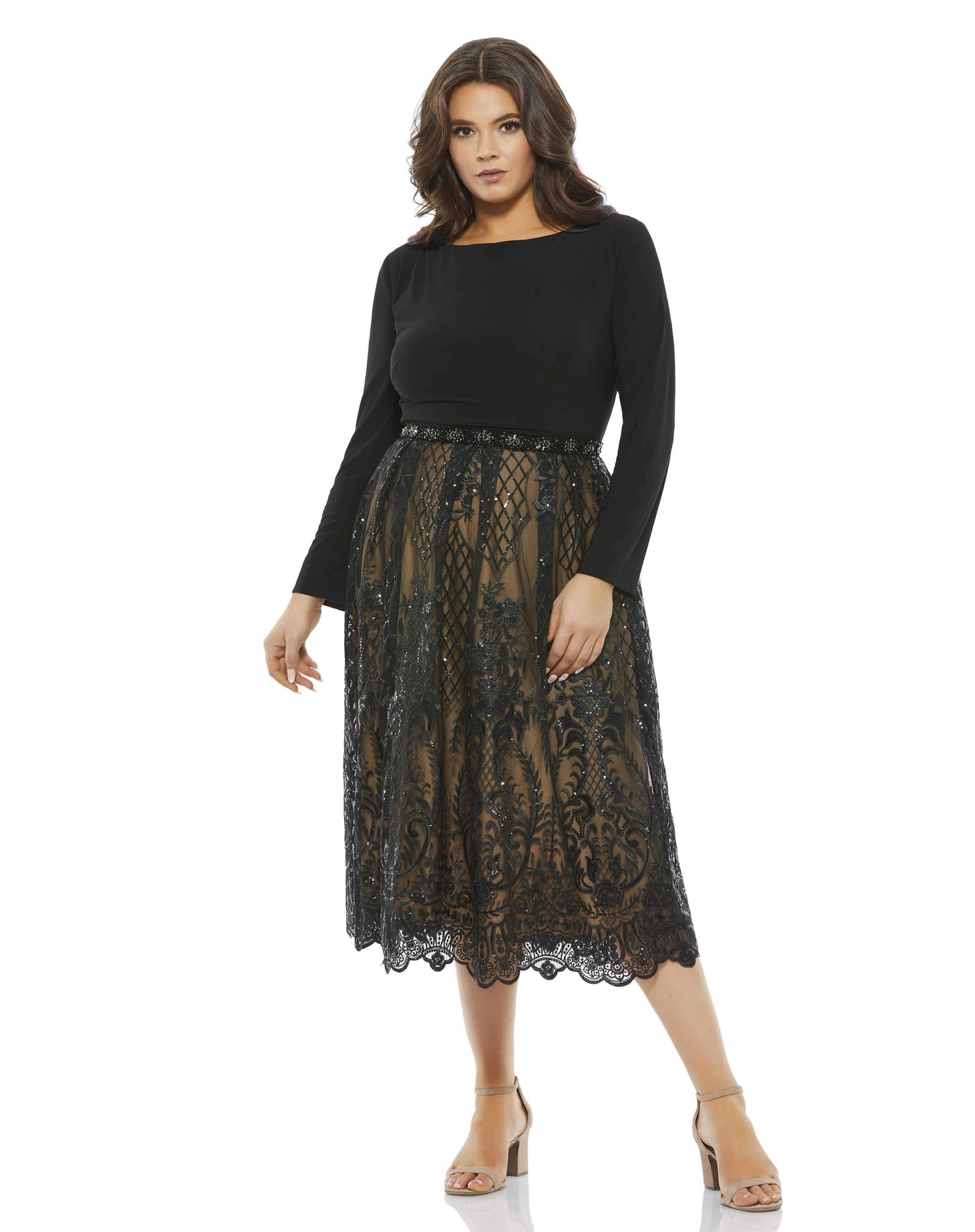 This chic cocktail dress makes a breathtaking look for special occasions. The mid-length dress opens with a minimalist jersey bodice cut with a pretty bateau neckline. An ornate beaded belt connects the top to an embroidered skirt stitched with lattices o