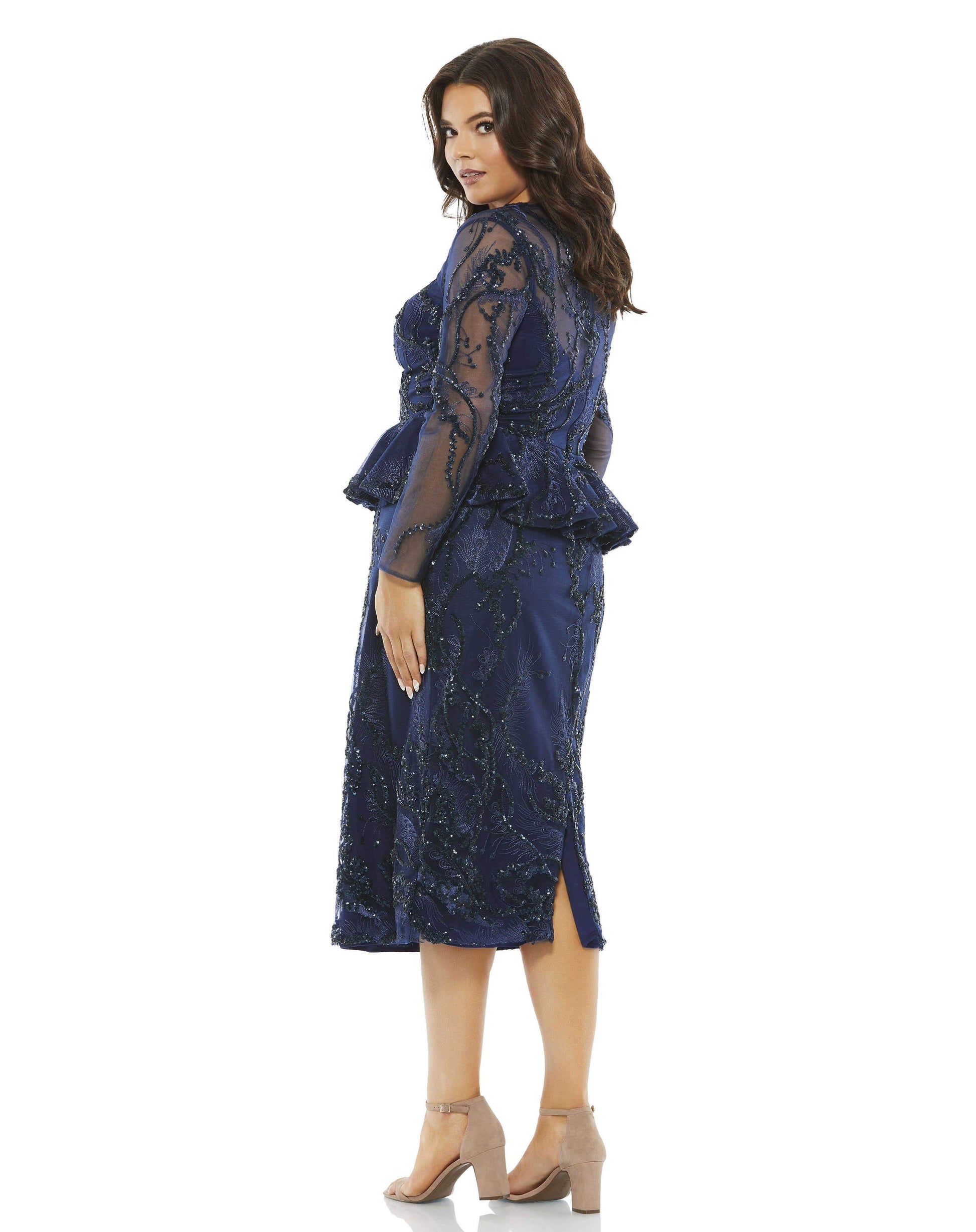 Make a grand entrance when you walk into a room wearing this dazzling dress detailed with streamers of sequins and color-matching embroidery. Lined with a deep V-neckline slip, the dress balances sexy sheerness and coverage with a peek-a-boo yoke, translu