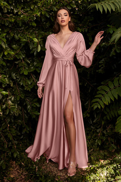 Cut from a soft satin, this floor length gown features romantic split blouson sleeves, a pleated wrap-effect bodice and deep v-neckline. The gathered a-line skirt features a thigh-grazing split so you can show a little leg. This dress is the embodiment of
