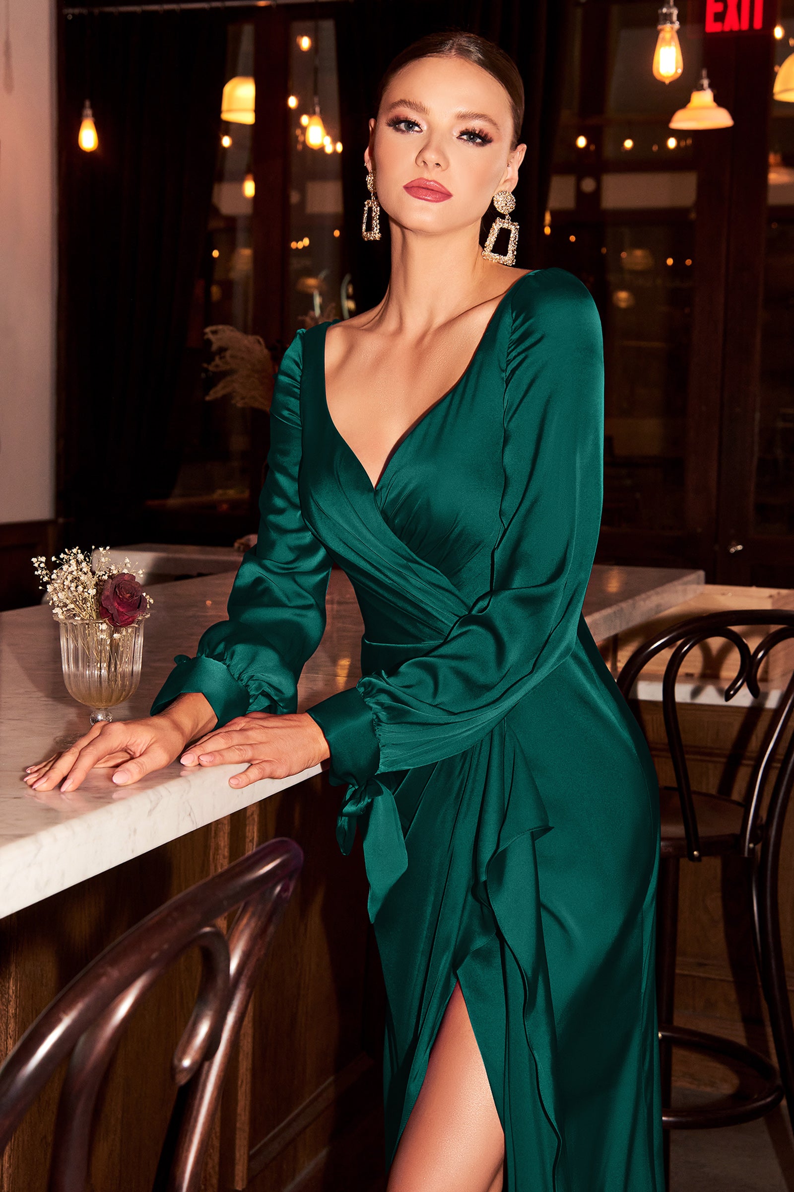 Smooth satin ensures the fluid drape of this elegant dress. The bodice features a wrap effect fashioned with pleats that cinch and sculpt your frame before falling to a romantic cascading drape and pooling floor-length hem. A front split is revealed flash