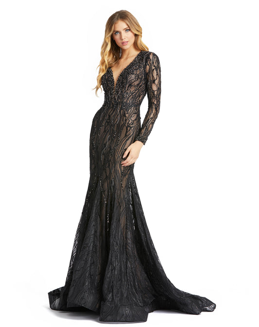 This trumpet gown is replete with luster and texture. Fashioned from glittery lace, the dress is elevated with beads, crystals, and sequins, and detailed with four-petal flowers. The modern shape hugs and highlights your body in all the right ways—startin
