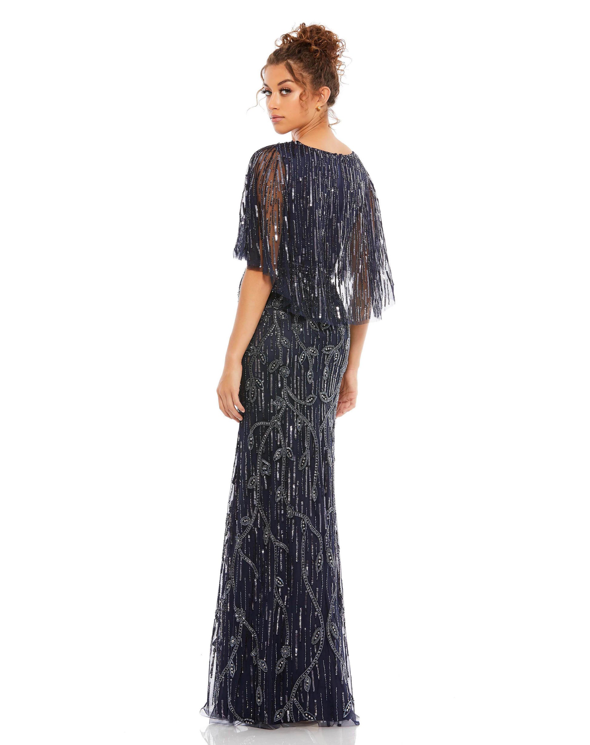 Elegant v-neck surplice evening gown adorned with sequin-and-bead floral accents throughout the mesh overlay. The sheer flutter sleeves and cape-style back feature rows of sequined embellishment. Mac Duggal 100% Polyester Fully Lined (with exception of sl