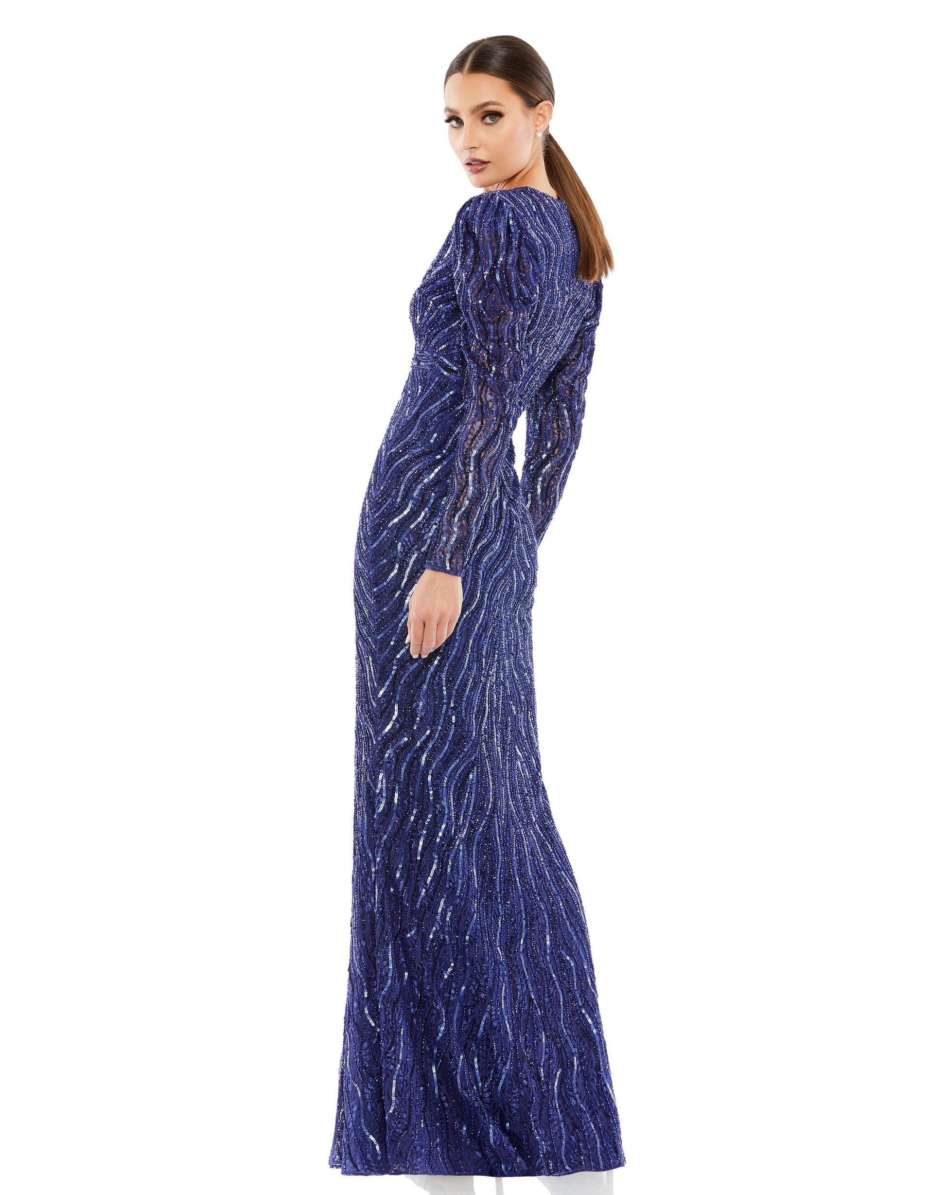Elegant puff sleeve trumpet gown adorned with sequins and beading throughout. Plunging v-neckline features a semi-sheer mesh inset, and an embellished waistband defines the waist. Mac Duggal Fully Lined Back Zipper 100% Polyester Long Sleeve Full Length V