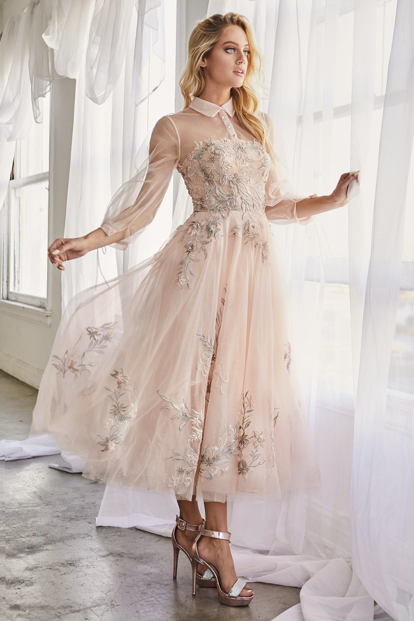 The Duchesa is perfectly appropriate for any special occasion. A fan favorite, this a-line cocktail dress in a beautiful pastel hue features a classic collar with an illusion yoke that connects to a corset-structured bodice overlayed with floral embroider