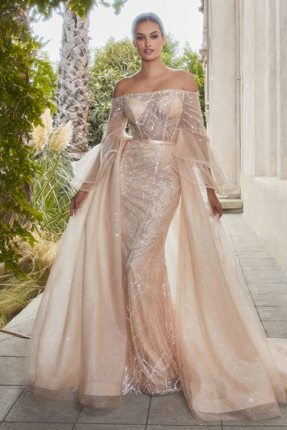 This fitted off the shoulder gown is a stunning and regal piece fit for a queen. The off the shoulder neckline and fitted silhouette of the gown are both flattering and elegant. The dress features layered flounce sleeves that add a touch of volume and mov
