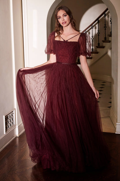 Channel your inner romantic beauty in this rich maroon ball gown. The lattice tulle beadwork adorns the straight neckline bodice flowing into the puff sleeve and flowing skirt. A lace up corset back compliments this gowns renaissance vibes. Cinderella Div