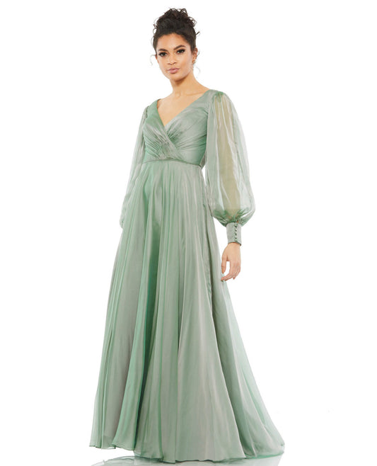 Flowing gown with sheer blouson sleeves, and a wrap, pleated bodice. The gown features a v-neckline, a long skirt and chiffon overskirt. Mac Duggal 100% Polyester Back Zipper Full Length Long Sleeves Style #67873