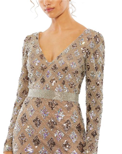 Ombré evening gown with geometric embellishment throughout the mesh overlay. This elegant long-sleeve evening gown features a hand-beaded belt at the natural waist and a floor-length trumpet skirt. Mac Duggal Back zipper Fully lined through bodice and ski